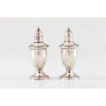 A salt and pepper cellarsEnglish silver Pair of urns with glass liners Marked "STERLING" to base
