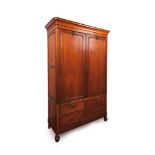A Romantic Era wardrobeSolid and veneered mahogany Two doors, two drawers and one long drawer