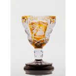 A drinking glass Bohemian crystal Cut decoration Yellow shades depicting courting scenes Possibly