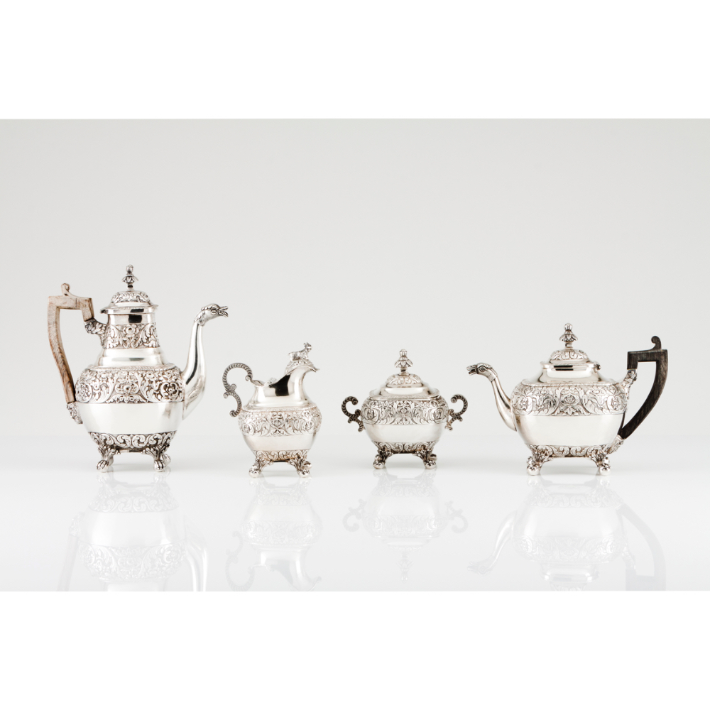 A "tête-à-têtê" tea and coffee set Teapot, coffee pot, milk jug and sugar bowl Portuguese silver,