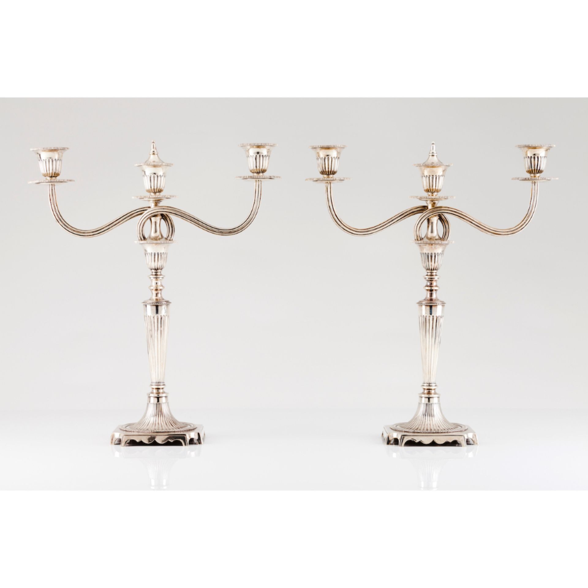 A pair of three branch neoclassical candelabraPortuguese silver Fluted decoration shafts Removable