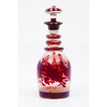 A bottle and stopperGlass Red decoration of foliage motifs Europe, 19th century (minor faults and