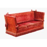 A Knowle sofaRed velvet upholstery Articulated arms and back England, 20th century (signs of wear)