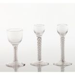 A set of four footed drinking glassesCrystal and glass Spiralled shaft decoration Europe, 19th