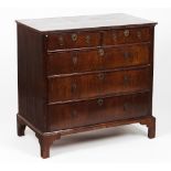 A Queen Anne chest of drawersOak and mahogany veneer Three long and two short drawers Metal