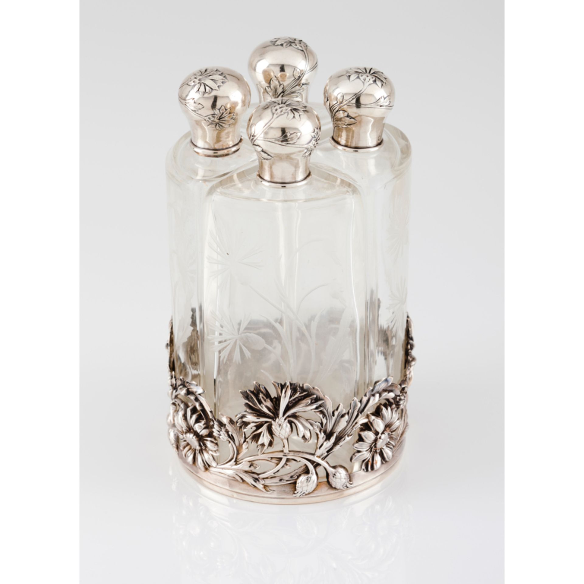 An Art Nouveau liqueur box setSilver Four engraved glass bottles Floral decoration Paris assay