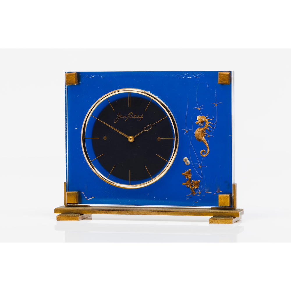 A Jean Richard table clockAcrylic and metal Carved and gilt seahorse decoration Switzerland, ca.