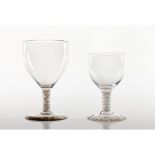 A pair of table drinking glassesBlown glass of milky spiral shaft Europe, 19th century Height: 16 cm