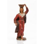 A woman carrying fruitsPossibly José Joaquim Teixeira Lopes (1837-1918) Polychrome terracotta