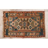 A kars rug, TurkeyIn wool and cotton Geometric design in shades of burgundy, beige and blue (signs