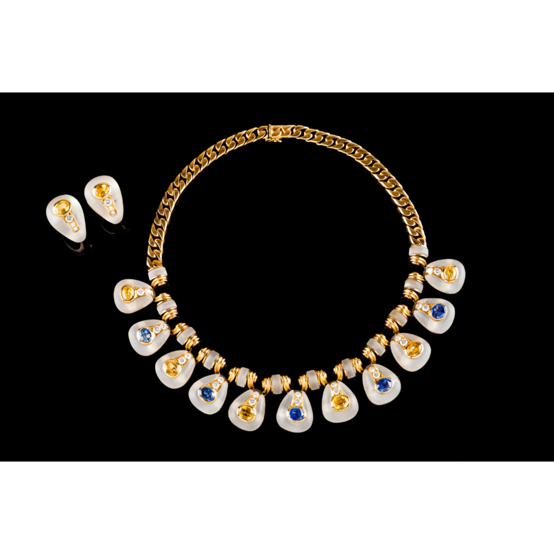 A necklace and pair of earringsGold Rock crystal elements set with 6 yellow sapphires, 5 blue