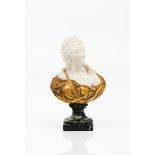 A female bustBiscuit porcelain Part gilt decoration Marble stand Europe, 19th centuryHeight: 18 cm