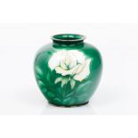 A vaseMetal Polychrome and enamelled decoration of green and white floral motifs with Chinese silver