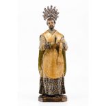 Saint Francis XavierCarved, polychrome and gilt wooden sculpture Unmarked silver radiant halo in