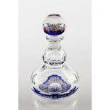 A bottle and stopperFaceted glass Inner "millefiori" decoration France, 20th centuryHeight: 19 cm
