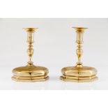A pair of large candle standsBrass After a 17th century prototype Height: 27 cm