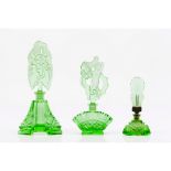 A set of three Art Nouveau perfume bottlesGreen glass paste Moulded decoration of foliage motifs,