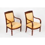 A pair of Louis Philippe fauteuilsMahogany and veneered Part carved decoration Textile upholstery