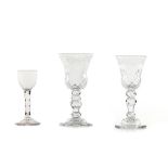 Three drinking glasses Cut glass Cut and acid etched decoration of scrolls and foliage motifs