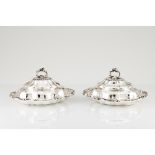 A pair of George IV vegetable dishesEnglish silver Gadrooned body and cover of volute decoration