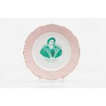 A commemorative Vasco da Gama plate, 1497-1898Sacavém Factory faience Pink and green decoration with