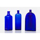 A set of three bottlesDark blue glass Europe, 19th / 20th century (two marked to base)Height: 27