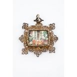 A pendantGilt filigree Center with paper fragment and mother-of-pearl to back7,5x7,5 cm