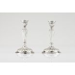 Four candlesticksSpanish silver, 20th century Fluted decoration Assay and same date maker's marks