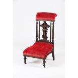 A prayer chairDarkened wood Cross and foliage motifs carved decoration, velvet seat and cushion