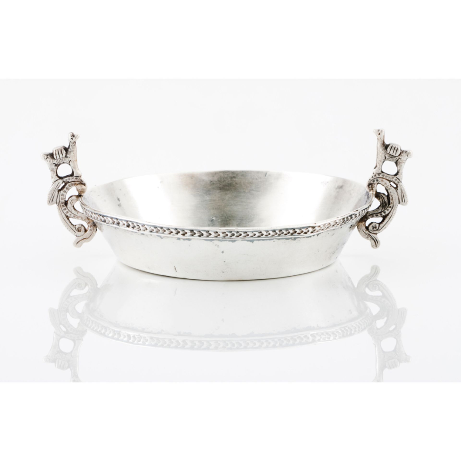 A bowlSouth-American silver (Peru), 19th / 20th century Scalloped and pierced handles with llama