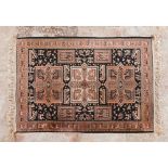 Oriental style rugGeometric pattern with stylised animals in salmon and black shades141x102,5cm