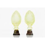 A pair of staircase finialsMoulded green glass Metal fittings Possibly Baccarat or Saint Louis