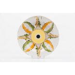 A plateFaience Yellow, green and orange decoration of foliage motifs 19th century (stapled