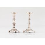 A pair of small candle sticksPortuguese silver, 19th century Turned and striated decoration On