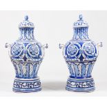 A pair of large pots with covers and standsFaience Blue reliefs decoration of foliage motifs,