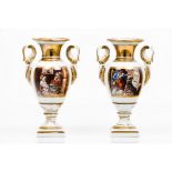 A pair of Empire amphoraePorcelain Part gilt decoration and framed "singerie" scenes France, 19th