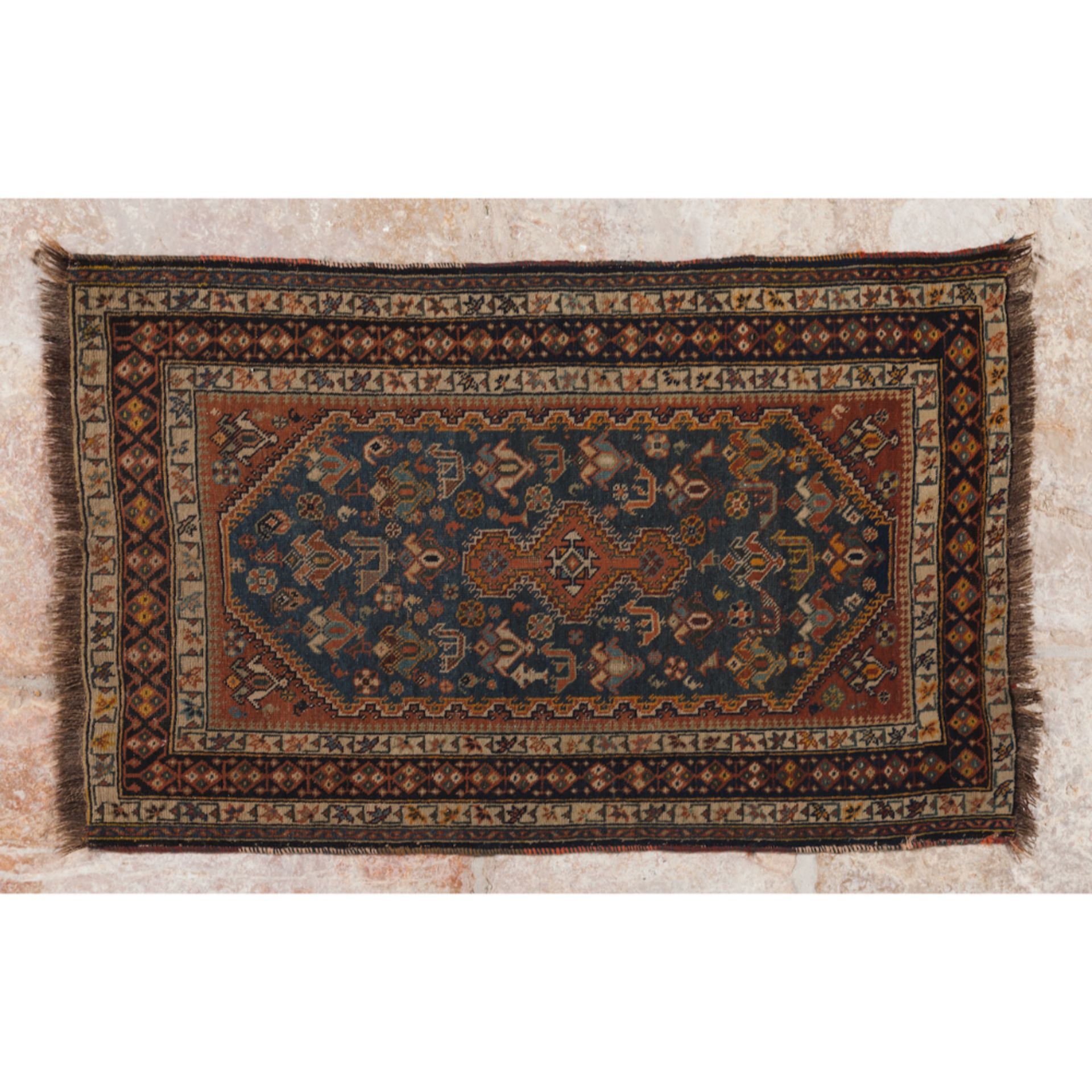 A kashal rug, IranIn wood and cotton Geometric design in shades of burgundy, green and blue (signs