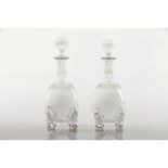 A pair of bottles and stoppersCrystal Acid etched decoration of heraldic shield for the marriage