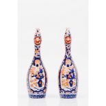 A pair of scent bottlesJapanese porcelain Imari decoration of landscape with garden, birds and other