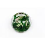 A paperweightFaceted glass paste Inner green reliefs decoration 20th centuryDiam.: 7,5 cm