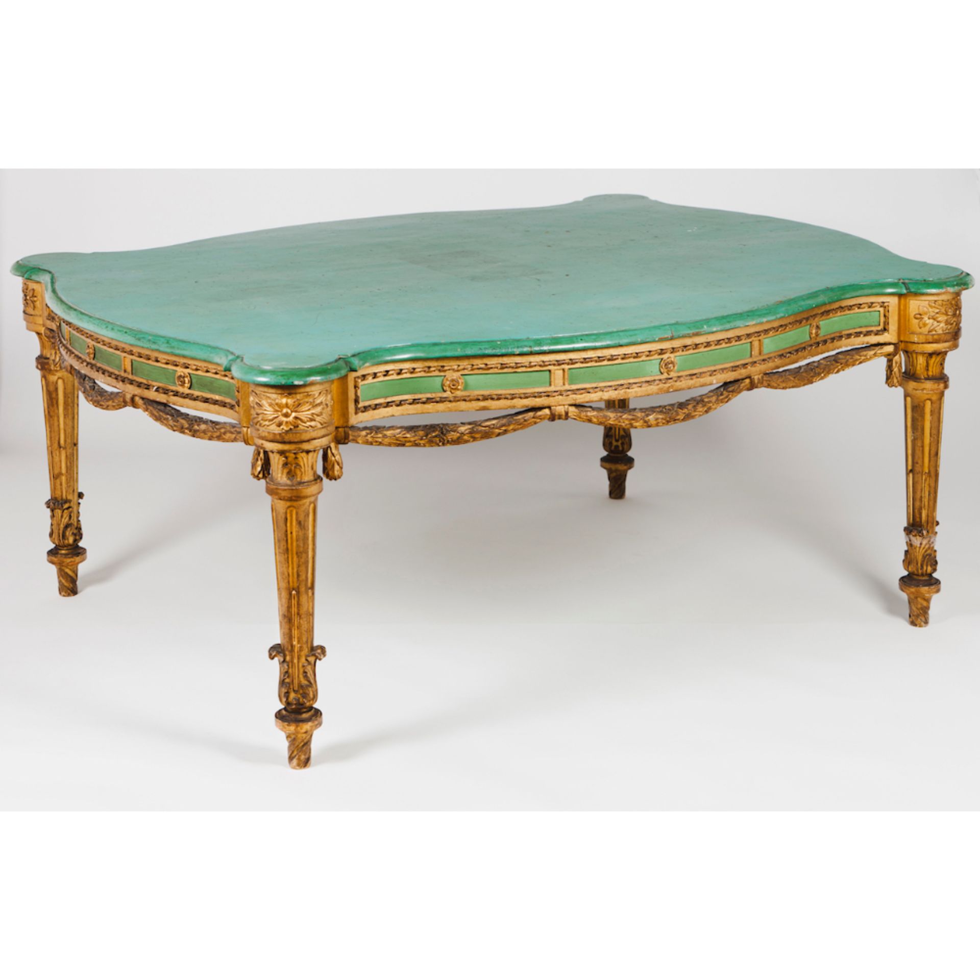 A large Neoclassical centre tableWood Gilt, carved and marbled decoration Scalloped top in green