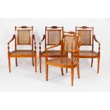 A set of four D.Maria armchairsCarved satin-wood Caned seats and backs Portugal, 20th century