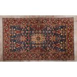A Kazak rugIn wool and cotton Geometric and Floral design in burgundy, blue and beige 475x330 cm
