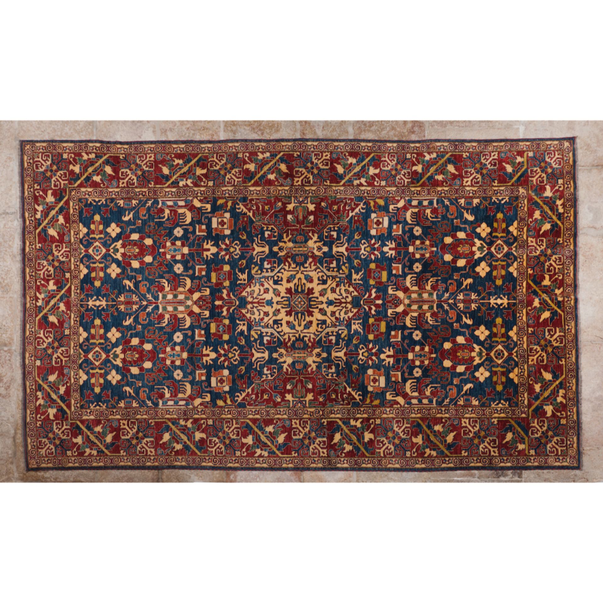 A Kazak rugIn wool and cotton Geometric and Floral design in burgundy, blue and beige 475x330 cm