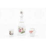 A group of three piecesBottle and stopper, one mug and a vase White opaque glass Polychrome