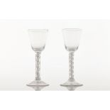 A pair of tall footed glassesMoulded glass Inner spiralled decoration to shafts Europe, 19th