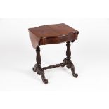 A Romantic Era side tableIn mahogany Legs and stretcher of carved decoration One drawer, elliptic