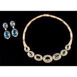 A parurePortuguese gold Necklace, pair of earrings and bracelet Necklace set with 7 blue topaz's the