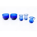 A group od five miscellaneous piecesA pair of bowls, a pair of small vases and a milk jug Blue glass