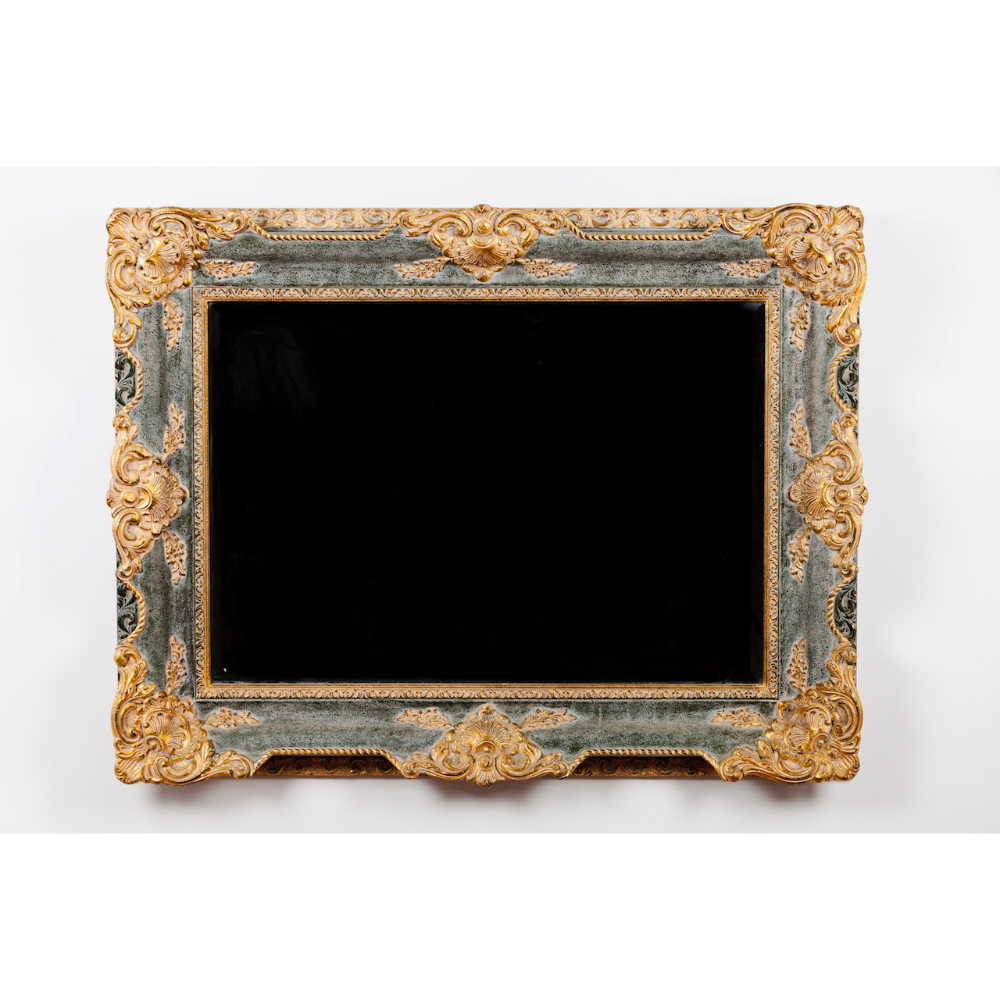 A Baroque mirrorCarved, gilt and painted wood 20th century90x116cm